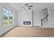 Bright living room with fireplace, ceiling fan, and natural light at 937 Alma Railway Dr # 555, Wake Forest, NC 27587