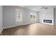 Bright living room with modern fireplace, ceiling fan, and natural light at 937 Alma Railway Dr # 555, Wake Forest, NC 27587