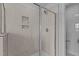 Modern shower with seamless glass and beautiful tiling and a niche for toiletries at 937 Alma Railway Dr # 555, Wake Forest, NC 27587