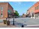 Intersection of Jones Avenue showcasing historic brick buildings, street lamps, and small-town charm at 937 Alma Railway Dr # 555, Wake Forest, NC 27587