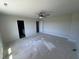 Spacious bedroom with carpet, a ceiling fan and two doors leading to a bathroom and closet at 195 Sawyer Mill Dr, Dunn, NC 28334