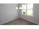 Bright dining room featuring hard wood floors, stylish chandelier, and a large window at 195 Sawyer Mill Dr, Dunn, NC 28334