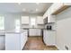 Bright kitchen featuring white cabinets, stainless steel appliances, granite countertops, and a stylish island at 195 Sawyer Mill Dr, Dunn, NC 28334