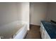 Main bathroom featuring a soaking tub and vanity with dual sinks at 31 Silver Ct, Smithfield, NC 27577