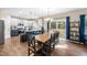 Open concept kitchen and dining area featuring stylish table and chairs with backyard access at 4228 Nc 42 Hwy, Raleigh, NC 27603