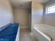 Bathroom with granite vanity and a soaking tub at 47 Silver Ct, Smithfield, NC 27577