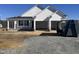 Newly constructed home with white siding and a two-car garage at 47 Silver Ct, Smithfield, NC 27577