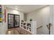 Bright hallway with built-in shelves and hardwood floors at 504 Heather Dr, Raleigh, NC 27606