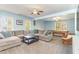 Spacious basement featuring a large sectional, a pool table and ample natural light at 143 Rawhide Dr, Louisburg, NC 27549