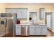 Well-equipped kitchen features stainless steel appliances, granite counters, and light grey cabinets at 143 Rawhide Dr, Louisburg, NC 27549