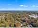 Neighborhood view with fall foliage and city skyline in background at 2600 Wade Ave, Raleigh, NC 27607
