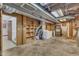 Unfinished basement laundry area with washer, dryer, and shelving at 2600 Wade Ave, Raleigh, NC 27607