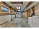 Unfinished basement with storage shelving and exterior access at 2600 Wade Ave, Raleigh, NC 27607