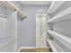 Modern bathroom with walk-in shower and shelving at 2600 Wade Ave, Raleigh, NC 27607