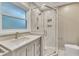 Updated bathroom with a large vanity and walk-in shower at 2600 Wade Ave, Raleigh, NC 27607