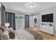 Spacious bedroom with large closet and TV at 2600 Wade Ave, Raleigh, NC 27607