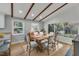 Dining area with wood table and chairs, hardwood floors and large window at 2600 Wade Ave, Raleigh, NC 27607