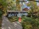 Ranch home with gray exterior, brick accents, and a landscaped yard at 2600 Wade Ave, Raleigh, NC 27607
