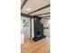 Living room with a black brick fireplace and wood flooring at 2600 Wade Ave, Raleigh, NC 27607