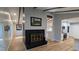 Living room with a black brick fireplace and wood flooring at 2600 Wade Ave, Raleigh, NC 27607