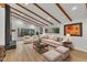 Spacious living room with hardwood floors, exposed beams, and a fireplace at 2600 Wade Ave, Raleigh, NC 27607