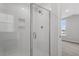 Modern bathroom featuring a shower with white tile surround and glass door at 276 White Oak Garden Way # 210, Garner, NC 27529