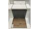 Gray cabinet, light countertop, white backsplash tiles, and gray-brown flooring selection at 276 White Oak Garden Way # 210, Garner, NC 27529