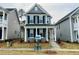 Charming two-story home with a covered porch, black shutters, and landscaped front yard at 276 White Oak Garden Way # 210, Garner, NC 27529
