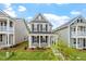 Attractive two-story house with gray siding, black shutters, and a well-maintained lawn and garden at 276 White Oak Garden Way # 210, Garner, NC 27529