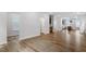 Large living space with hardwood floors connecting to the kitchen, complete with neutral tones and modern finishes at 276 White Oak Garden Way # 210, Garner, NC 27529