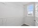 Walk-in closet features built-in shelving, carpet, and a window with a view at 276 White Oak Garden Way # 210, Garner, NC 27529