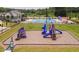 Aerial view of a community playground, pool, and clubhouse at 604 Spellbrook Rd, Zebulon, NC 27597