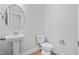 Powder room with pedestal sink and toilet at 604 Spellbrook Rd, Zebulon, NC 27597