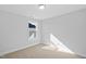 Bedroom features carpet, a window, and white walls at 604 Spellbrook Rd, Zebulon, NC 27597