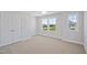 Spacious bedroom with large windows and ample natural light at 604 Spellbrook Rd, Zebulon, NC 27597
