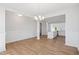 Spacious dining area featuring hardwood floors and views to the kitchen and entry at 604 Spellbrook Rd, Zebulon, NC 27597