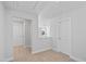 Bright hallway features neutral carpet and white trim with an adjacent open landing overlooking a living area at 604 Spellbrook Rd, Zebulon, NC 27597