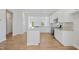Modern kitchen featuring stainless steel appliances, white cabinetry, and granite countertops at 604 Spellbrook Rd, Zebulon, NC 27597