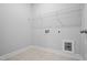 Laundry room with tile flooring and white walls at 604 Spellbrook Rd, Zebulon, NC 27597