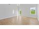 Bright living room featuring wood-look flooring and a large window with a view at 604 Spellbrook Rd, Zebulon, NC 27597