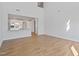 Open-concept living area showcasing hardwood floors and access to the kitchen and other living spaces at 604 Spellbrook Rd, Zebulon, NC 27597