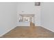 Bright and airy living space with hardwood floors and an open view of the modern kitchen at 604 Spellbrook Rd, Zebulon, NC 27597