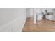 Open-concept living space featuring wood floors and views into the kitchen at 604 Spellbrook Rd, Zebulon, NC 27597