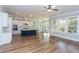 Open-concept kitchen with a large island, stainless steel appliances, and hardwood flooring at 1112 Armsleigh Ct, Raleigh, NC 27603