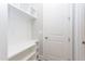 Well-lit mudroom with built-in storage, shelving, and a closet for coats and shoes at 1112 Armsleigh Ct, Raleigh, NC 27603