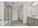 Main bathroom with double vanity, large shower, and gray tile floor at 115 Fairwinds Dr, Lillington, NC 27546