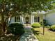 Inviting front porch with columns and lush landscaping at 1601 Dairyland Rd, Chapel Hill, NC 27516