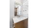 Bathroom vanity with sleek faucet, decorative mirror, pendant lighting, and luxury Kohler toilet at 196 Mountaintop Cir, Pittsboro, NC 27312
