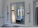 Modern bathroom with crystal trimmed mirrors, decorative lighting, and vanity area with light marble counter at 196 Mountaintop Cir, Pittsboro, NC 27312