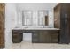 Elegant bathroom with double vanities, marble countertops, modern lights and fixtures at 196 Mountaintop Cir, Pittsboro, NC 27312